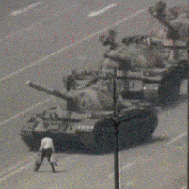 a lone man standing in front of a column of tanks in Tiananmen Square, Beijing, China, 1989